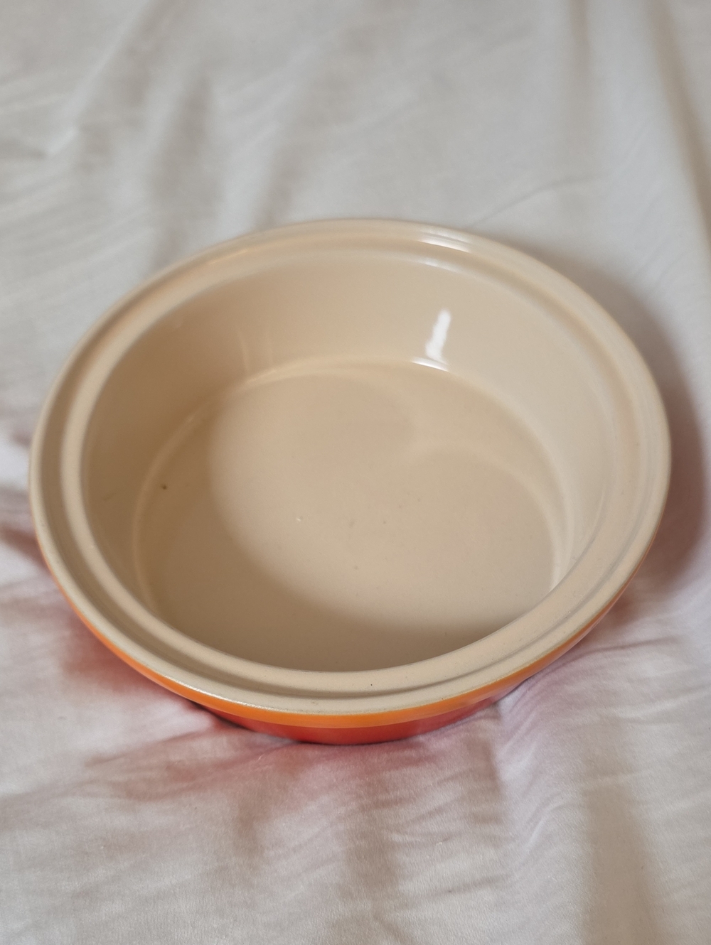 Le Creuset Two-Tone Ceramic Serving Bowl in Cream and Orange